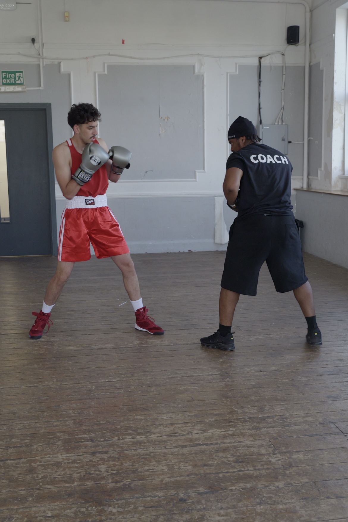 Leonardo coaching a boxer through fundamentals